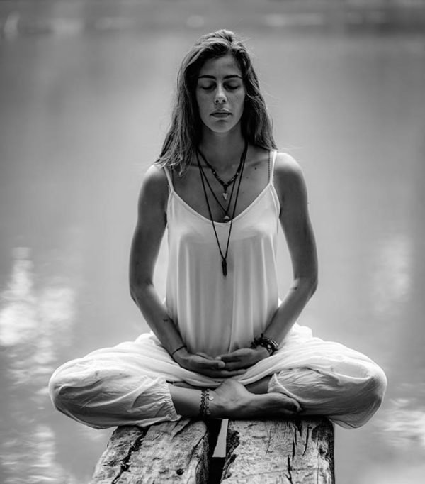 Young woman meditating with her eyes closed.